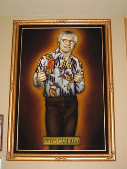 An oil painting of Zumiez Founder and Chairman Tom Campion in the Zumiez lobby.