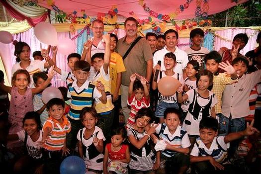 Jedidiah owner Kevin Murray (with beard) in Cambodia with World Vision. Photo by Aaron Chang.