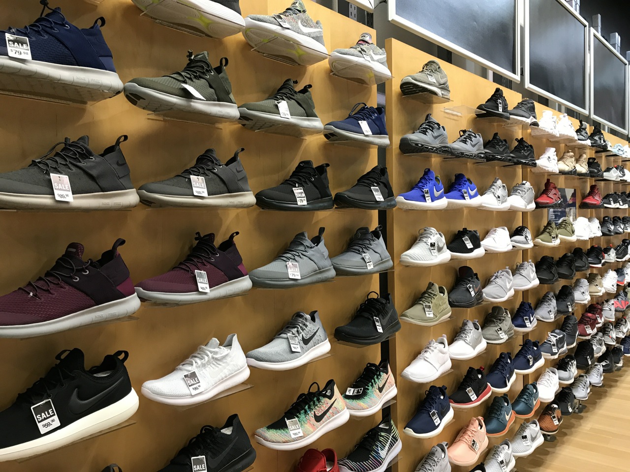 A wall of Nike shoes on sale at Finish Line