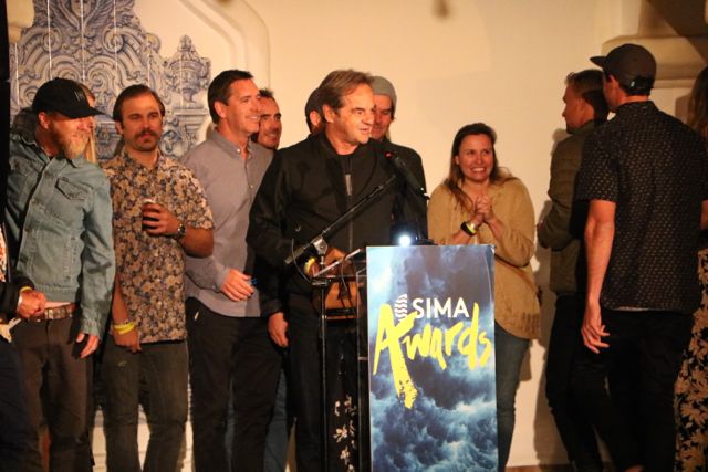 Paul Naude accepting Vissla's Men's Apparel Brand of the Year award - Photo by SES