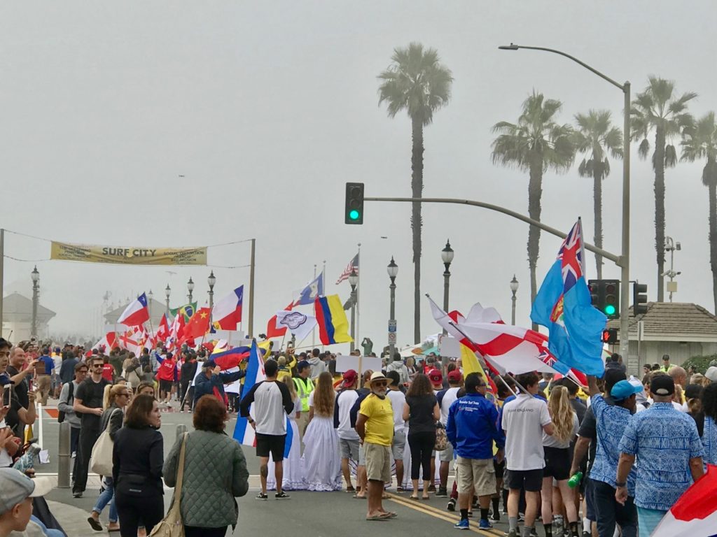 The parade crosses Main Street to the beach