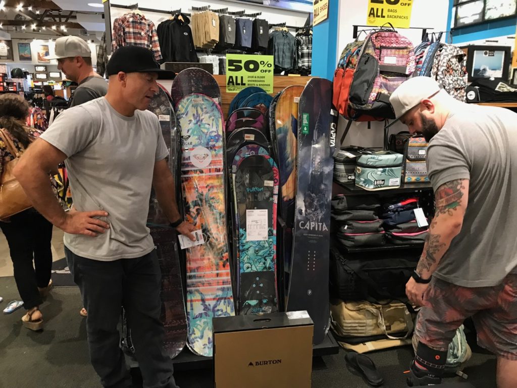 Dave Downing of Burton was hustling the whole day. Here he was helping with a boot fitting.