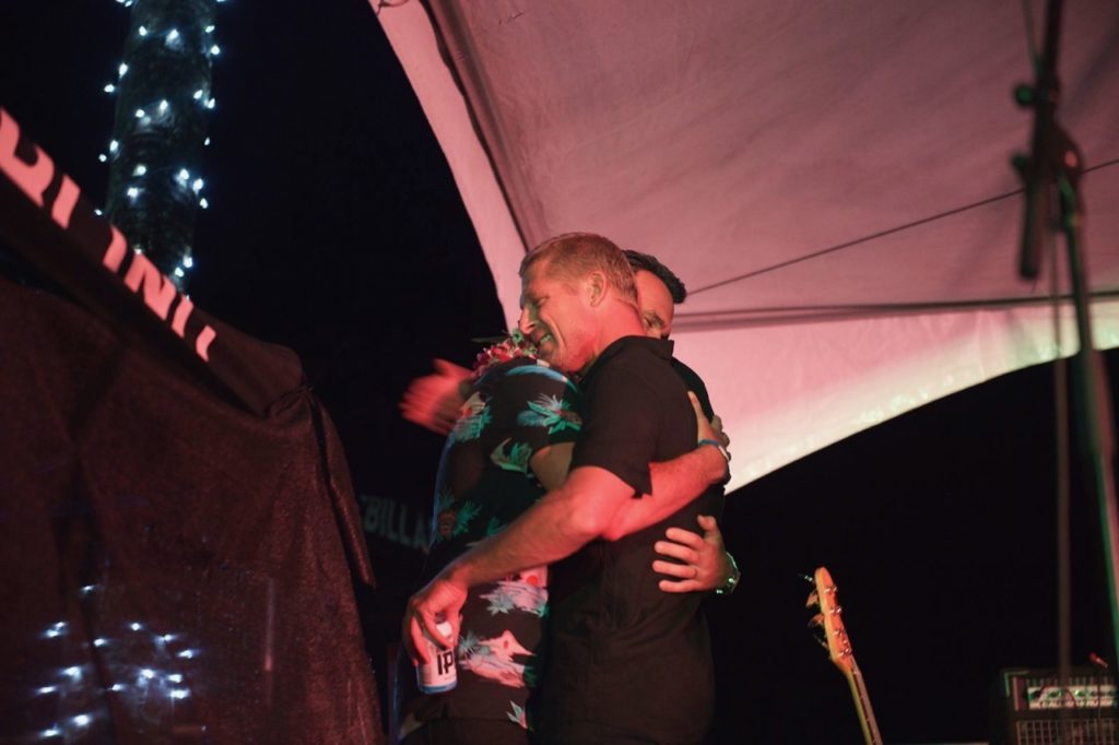 Mick Fanning hugs Joel after Mick's speech at Joel's retirement party