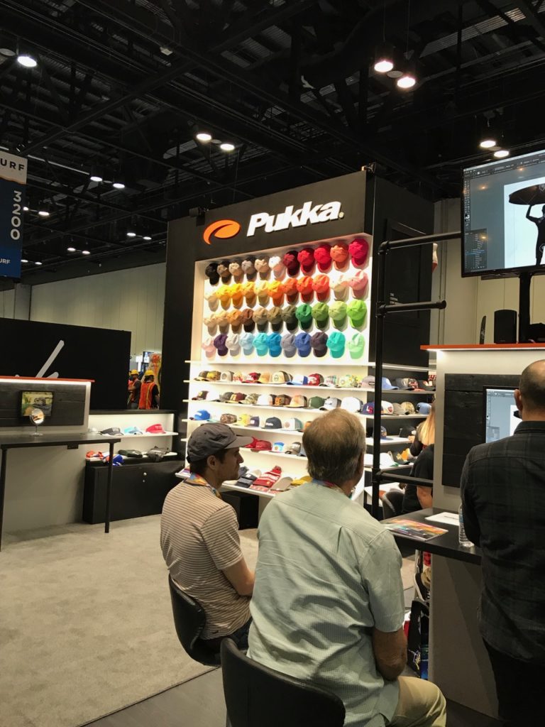 Pukka had computer stations and worked with customers to design hats on the floor