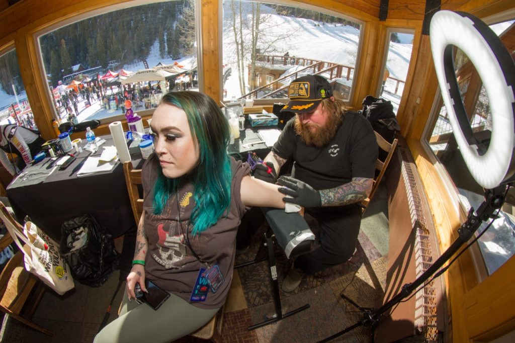 No. 1 sales person Aubrey Peterson getting a tattoo - Photo courtesy of Zumiez