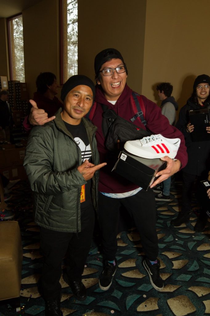 Daewon Song handing out Adidas shoes - Photo courtesy of Zumiez