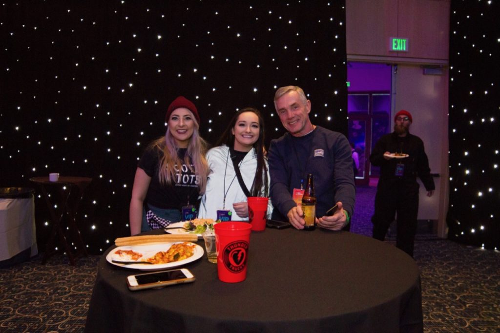 CEO Rick Brooks with Zumiez employees - Photo courtesy of Zumiez