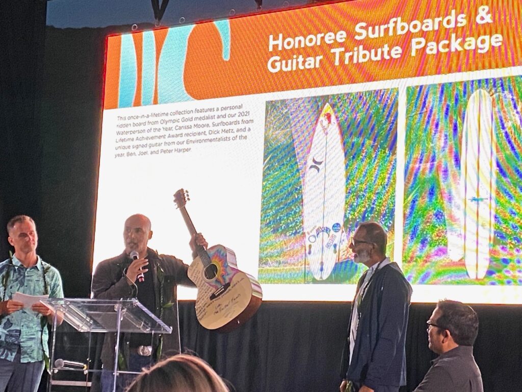 Peter Harper with a guitar he donated to the auction 