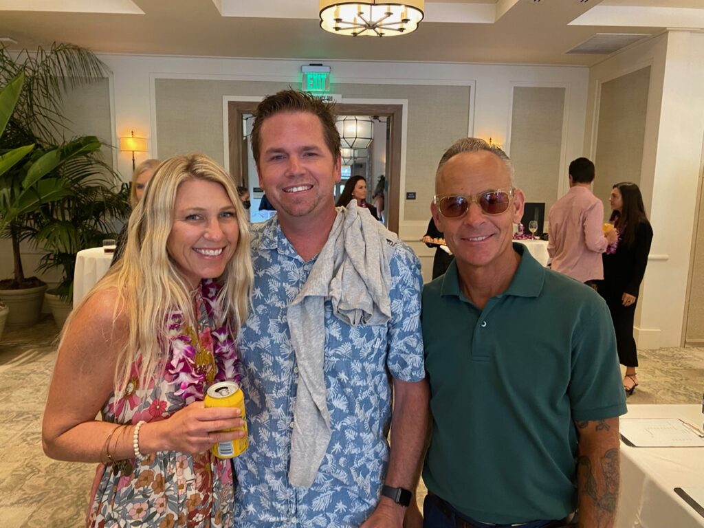 Sarah Reilly with Boardriders' Mike Reilly and Fuzzy Schroeder