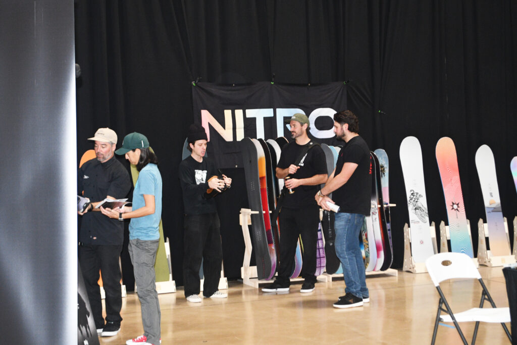 Account meetings at the Nitro Snowboards booth during About Time.  Photo by SES. 