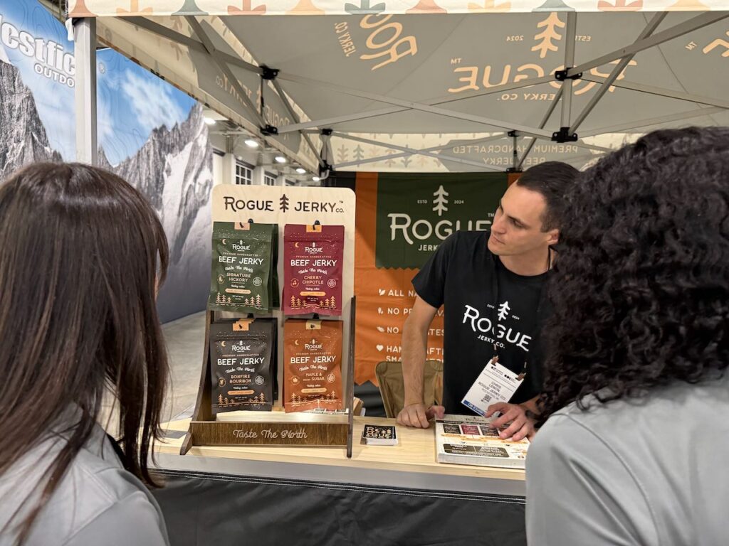 Perusing Rogue Jerky, which was busy at the show. Photo by SESO.