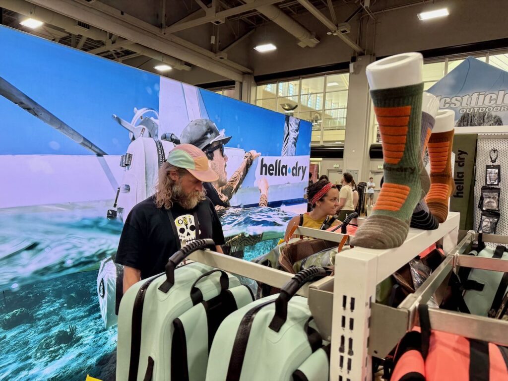 Terra Running Company shopping the Hella Dry booth. Photo by SESO.