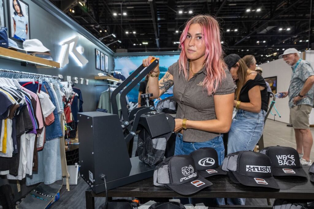 Printing hats at Rusty. Photo courtesy of Surf Expo.