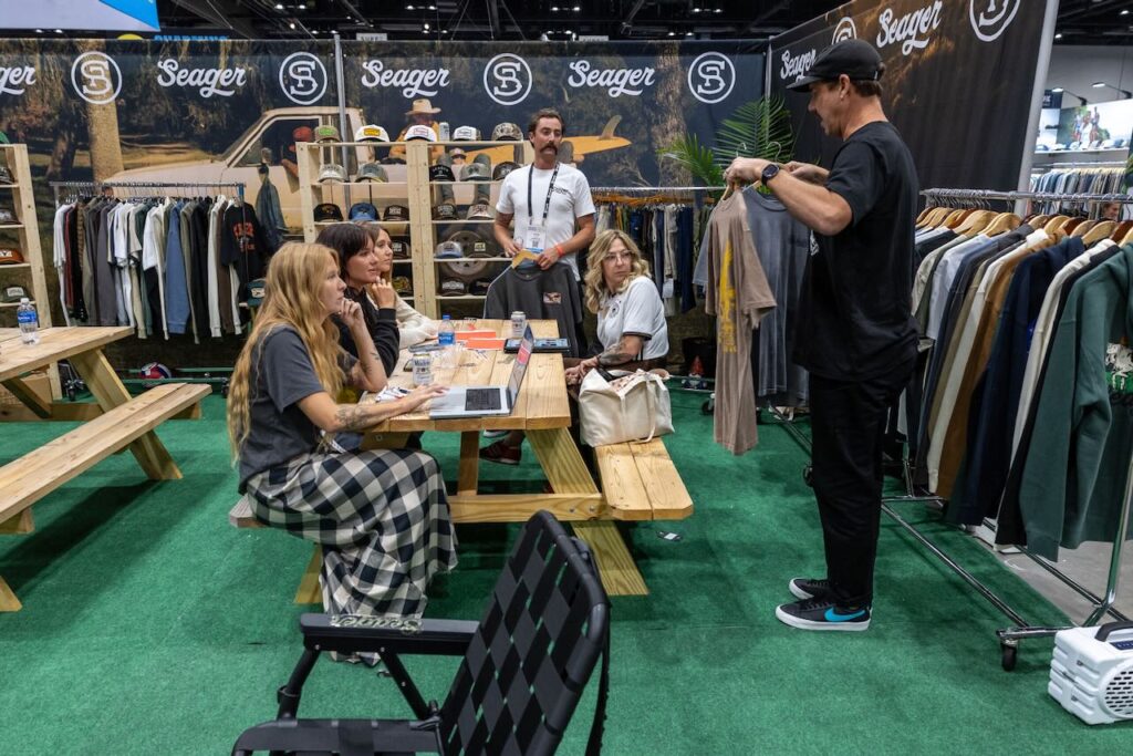 Island Water Sports reviewing the Seager line. Photo courtesy of Surf Expo. 