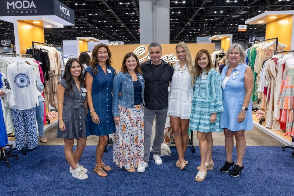 The Surf Expo team with the Elan brand, which provided their outfits for the show. Photo courtesy of Surf Expo.