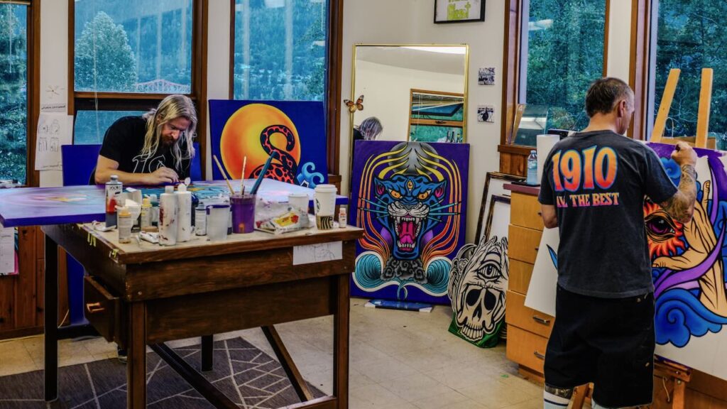 1910 co-founders Schoph and Jaime Lynn working on art in the Nelson studio. Photo courtesy of 1910. 