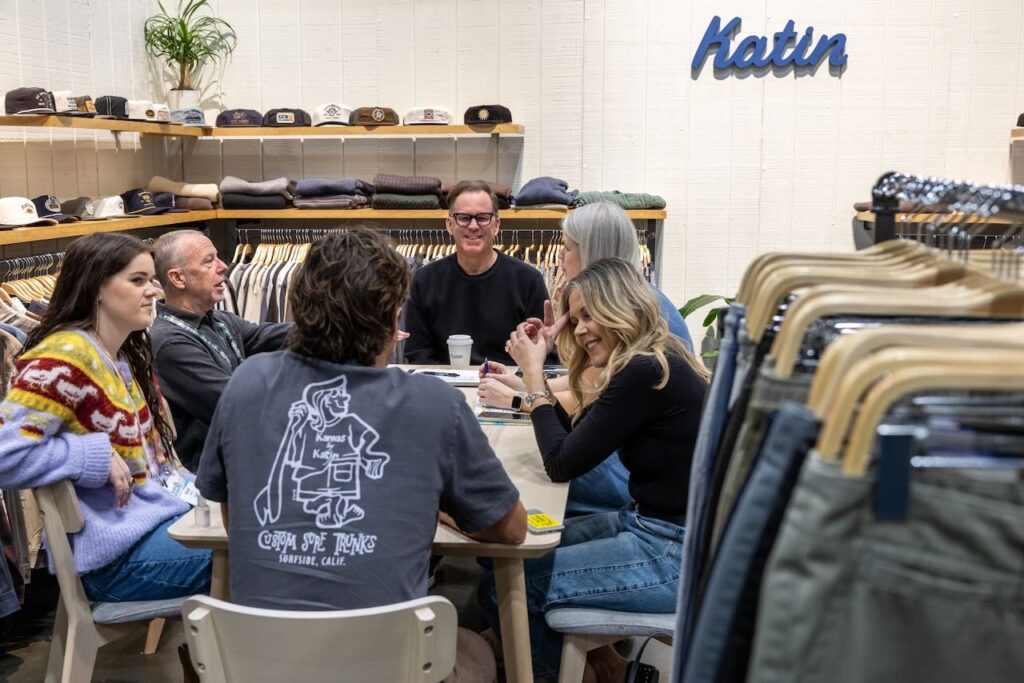 A meeting at the Katin booth. Photo courtesy of Surf Expo. 