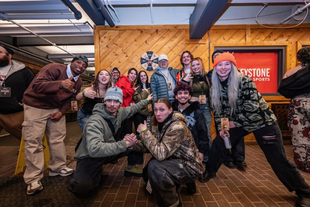 Zumiez employees with founder and Chairman Tom Campion, in back with white hat. Photo by Zumiez. 
