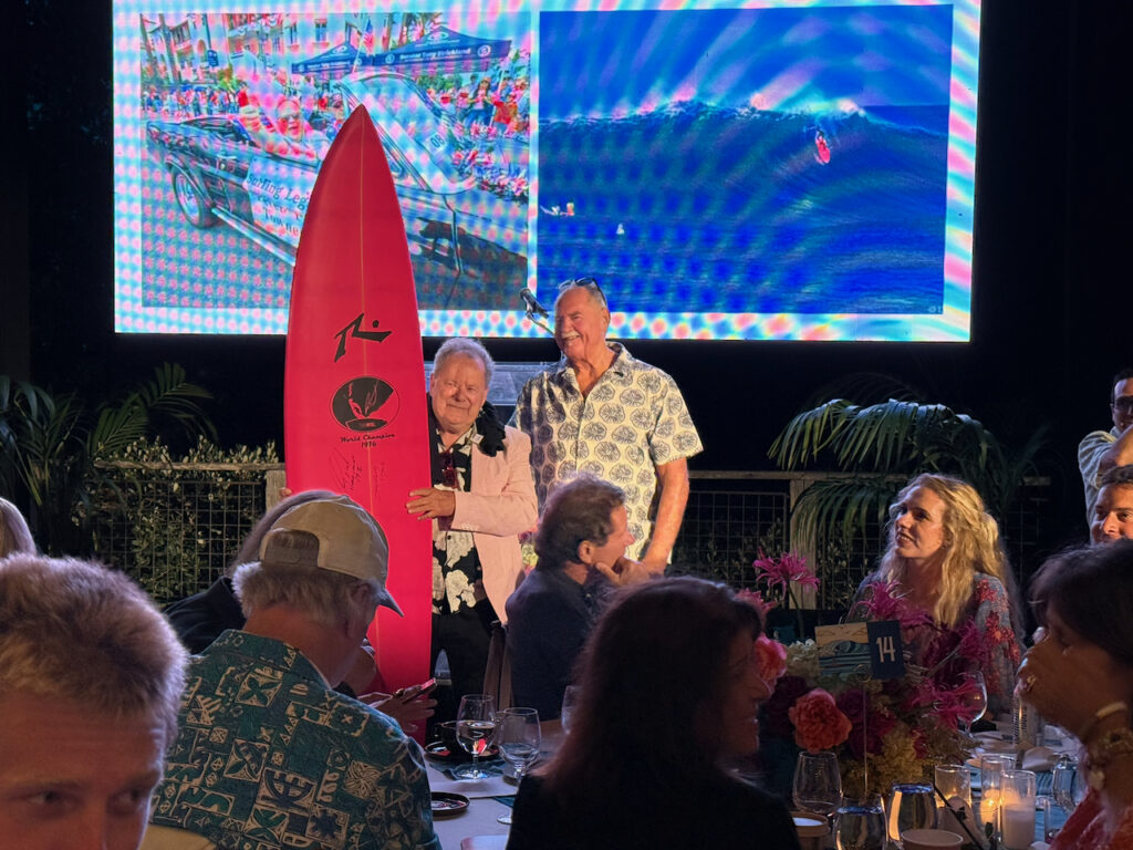PT Townend and Rusty Preisendorfer with a replica of the board he rode to victory at the inaugural IPS/WSL World Championship in Hawaii. Photo by Ian Kose, courtesy of SIMA.