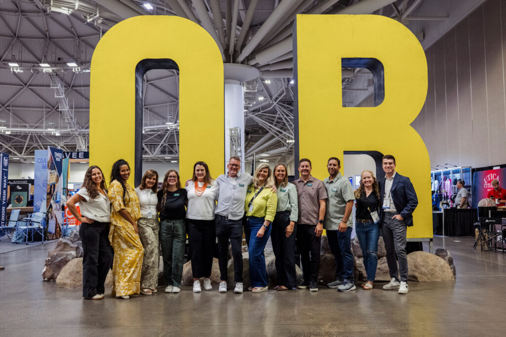 The larger Outdoor Retailer and Emerald team that worked on the event. A retailer trying out product at Outdoor Retailer 2026. Content Creators in the Popfly booth. Photo by Tim Aukshunas, courtesy of Outdoor Retailer.