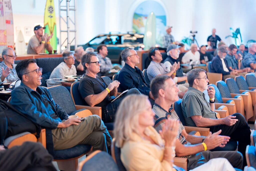 Listening to the presentations. Photo by Dipan Desai Photography.